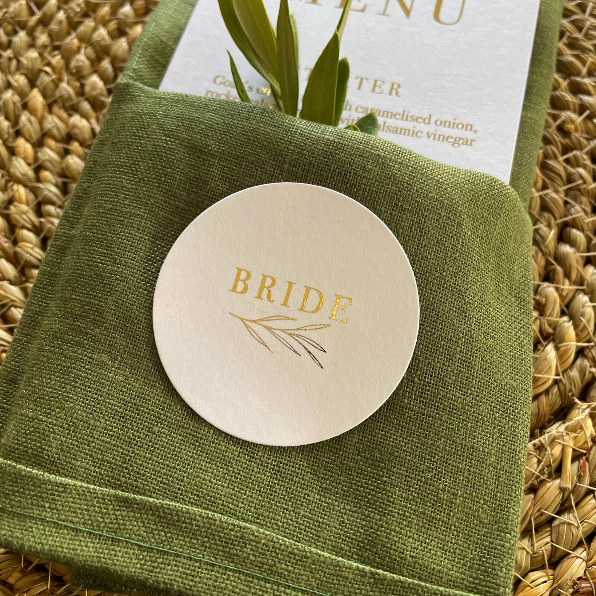 gold foil and white circular name tags for place settings wedding or engagement party
