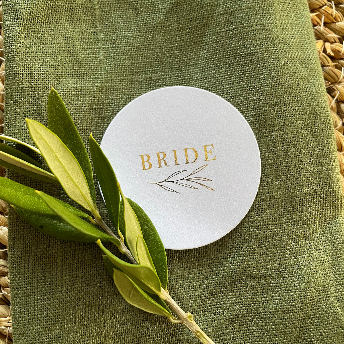 round gold foil and white name tags for wedding tables