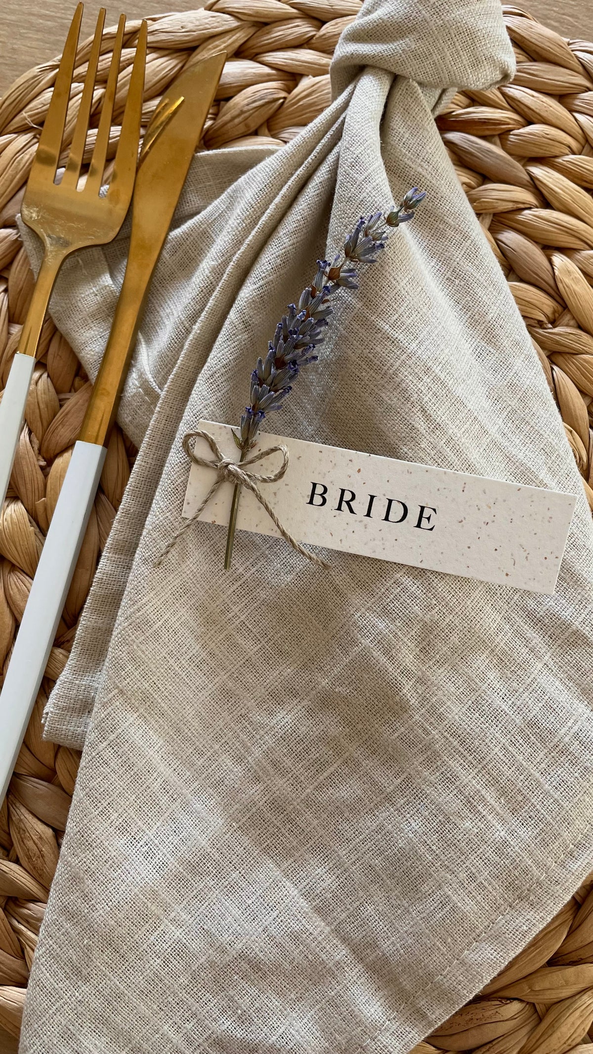 recycled fleck card name tags with dried lavender flower stem tied with brown twine for rustic wedding reception
