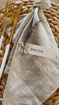 recycled fleck card name tags with dried lavender flower stem tied with brown twine for rustic wedding reception