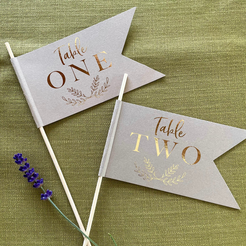 brown and gold foil table number flags for wedding centrepiece